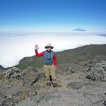 Climbing to great heights for charity Martyn Bould waves from high above the clouds.