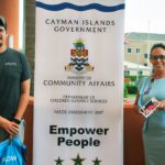 Foster Group supplies smartphones to care homes Car City manager Taylor Foster delivers the phones to Ministry of Community Affairs Chief Officer Teresa Echenique