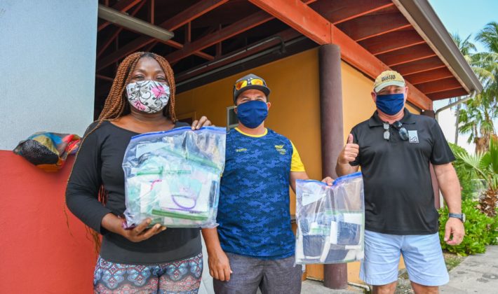 Anesa Miller Goodall and Jhon Mora, of Kitesurf Cayman have repurposed their sewing machines, typically used for kitesurfing repairs, to make free face masks for the community