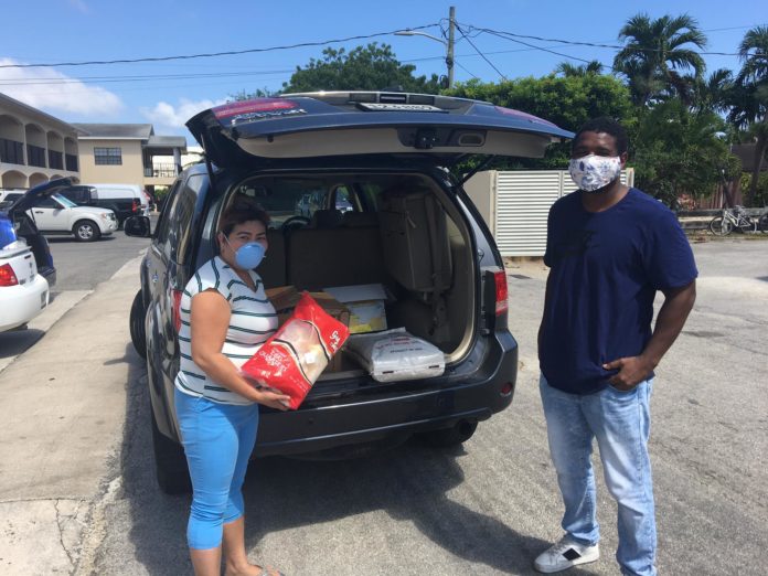 Caroline Tajonera, pictured with Alric Lindsay, is helping coordinate support for others in the Filipino community