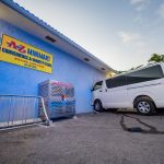 Man charged in mini-mart crash case white bus crashed into the wall of the A-Z Minimart on Godfrey Nixon Way following a police chase on Monday afternoon