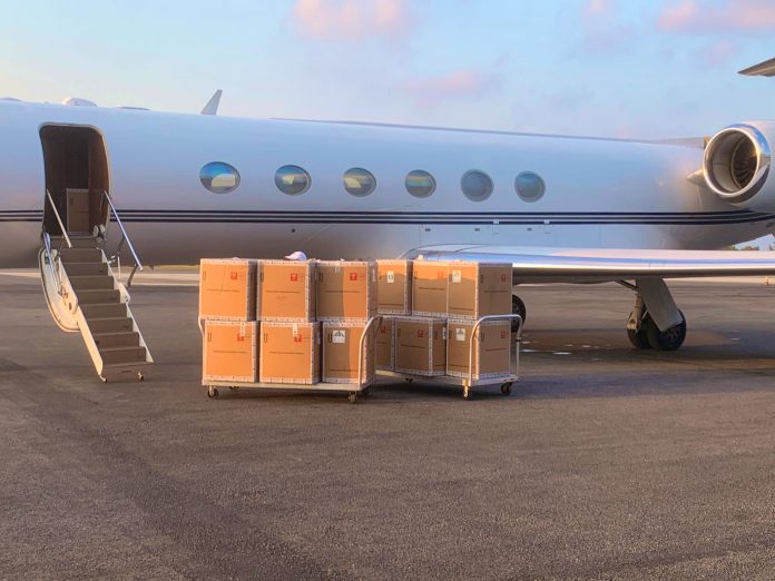 Test kits1 Boxes of the test kits arrive on a private plane at the Owen Roberts International Airport on Wednesday morning.