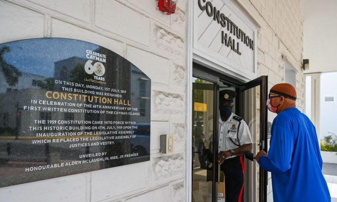 A man enters Constitution Hall during the first day of curfew cases.