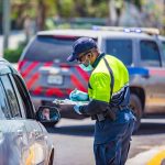 The issue explained: Life versus liberty in a COVID-19 world Police check point