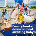 Stranded family hunkers down on boat awaiting baby’s birth