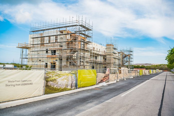 OLEA in Camana Bay is one of multiple construction projects ready to resume.