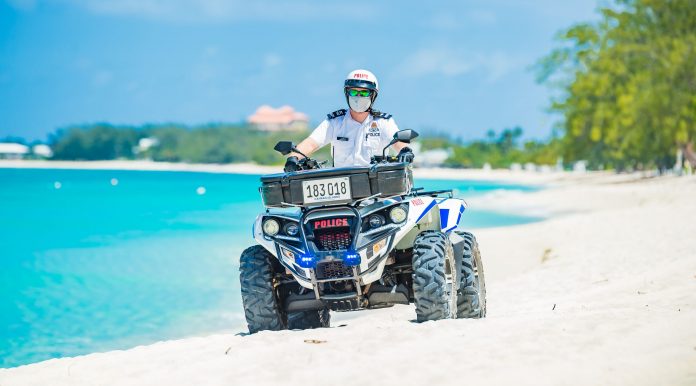An officer on ATV beach patrol.