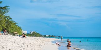 Ask the experts – The future of tourism Families enjoy the serenity of Seven Mile Beach on a recent afternoon. Photo: Taneos Ramsay