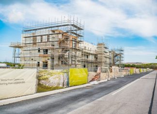 Cayman’s construction engine kicks into high gear