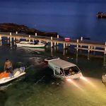 Van ends up in water while towing jet-skis
