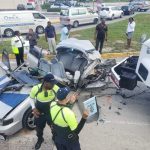 Updated: Woman cut free from crashed car