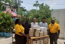 Alumni group distributes food packets