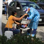 What is the risk to Cayman from a COVID outbreak?