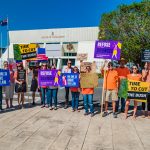 Demonstrators gather to protest against Speaker Bush