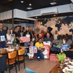 Tourism Attraction Board staff donates gifts to toy drive