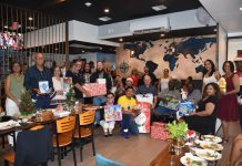 Tourism Attraction Board staff donates gifts to toy drive