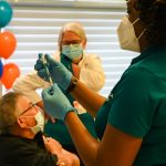 COVID-19 vaccination schedule 22 March – 10 April Nurse prepares COVID-19 vaccine