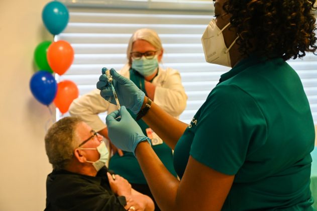Nurse prepares COVID-19 vaccine
