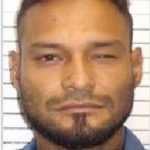Wanted man held as police hunt another