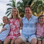 What does it cost to raise a child in Cayman?