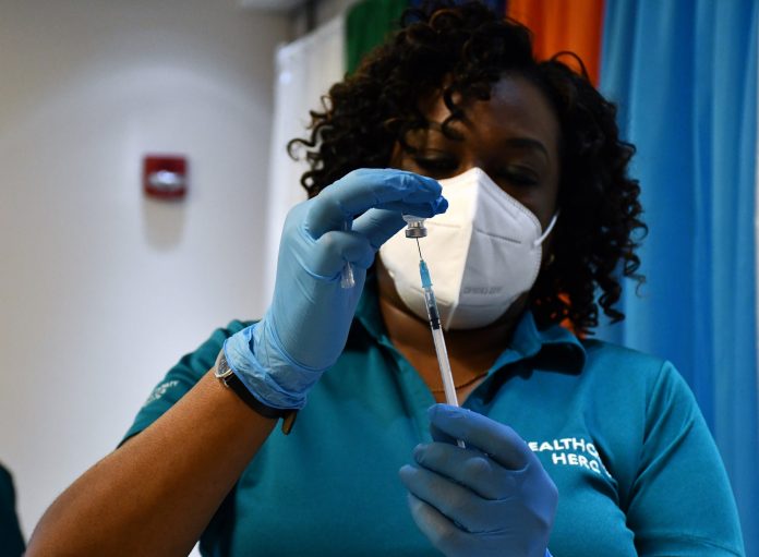 The premier said Cayman can reopen its borders once 70-80% of the entire population had been vaccinated.