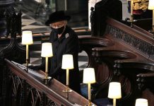 Queen Elizabeth stands alone as Philip is laid to rest Queen Elizabeth