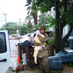 Cayman Islands Regiment Helps Evacuate Vulnerable Residents Cayman Islands Regiment commander comforts baby after Tropical Storm Grace