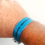 Blue wristbands for securely vaccinated arrivals