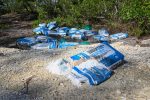Dozens of bags of waterlogged mortar dumped by roadside