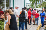 Long lines form for boosters, vaccines