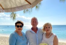 ‘Twosday’ wedding on Seven Mile Beach after 2-year wait