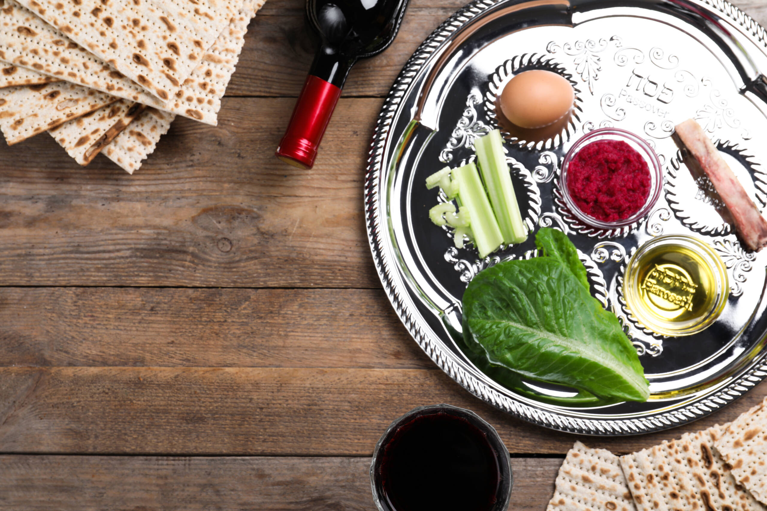 Flat lay composition with Passover Seder plate (keara) on wooden