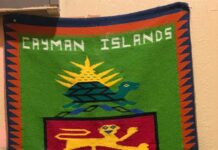 Handmade Cayman coat of arms tapestry stolen from restaurant