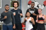 Nigel Paul climbs in the ring with local boxers