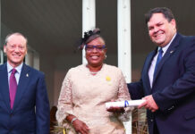 PHOTOS: Recipients of New Year’s Honours collect their awards Nurse for Little Cayman, Charmaine Coore, with Roper and Panton after receiving her honours.