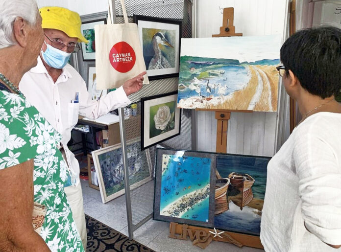 Guests visit the SimoneS Art Gallery in Cayman Brac copy