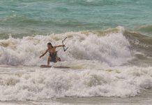 Surfers brave waves left by Ian
