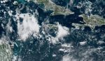 Passing showers drench Cayman while storm brews in Atlantic