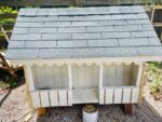 Kids to decide colour scheme of restored miniature Cayman cottages