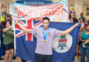 Cayman welcomes home golden swimmer Jordan Crooks