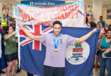 Cayman welcomes home golden swimmer Jordan Crooks