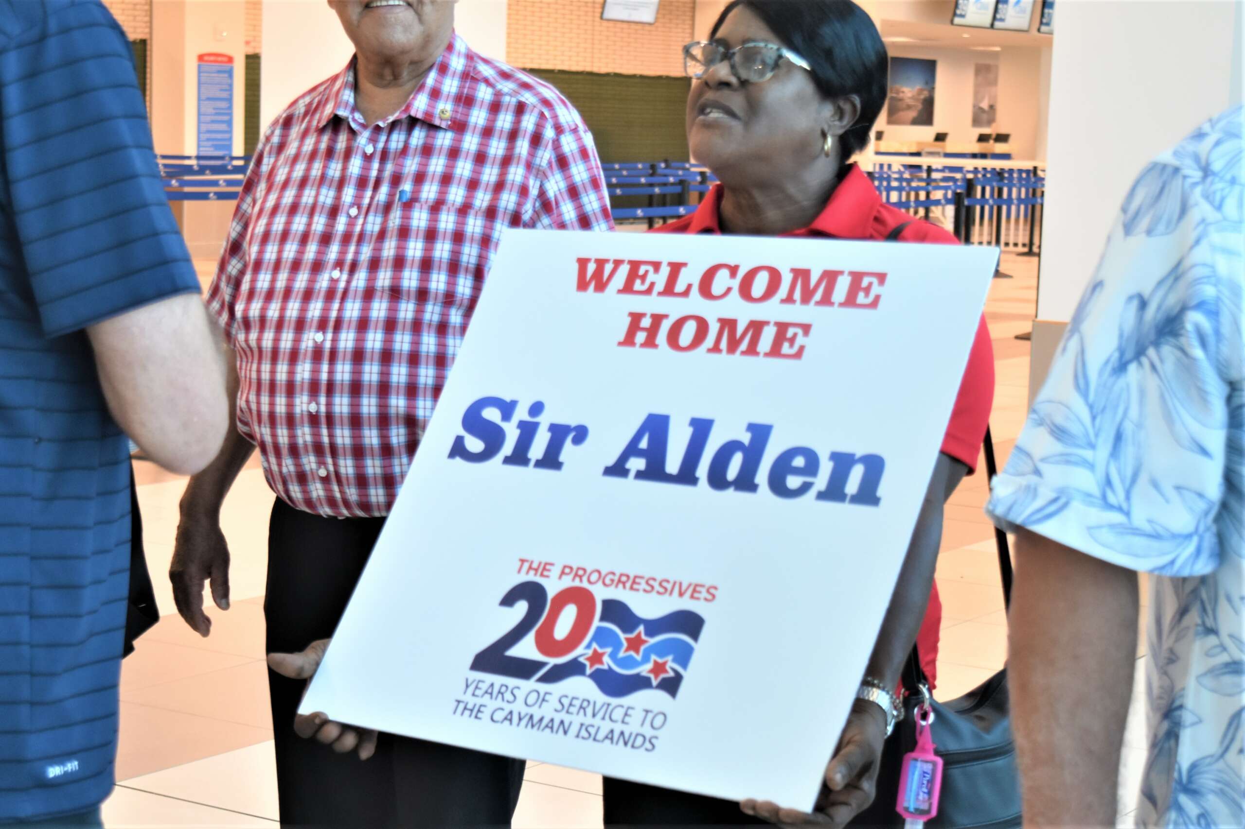 Cheers as McLaughlin returns after being knighted by King Cayman Compass