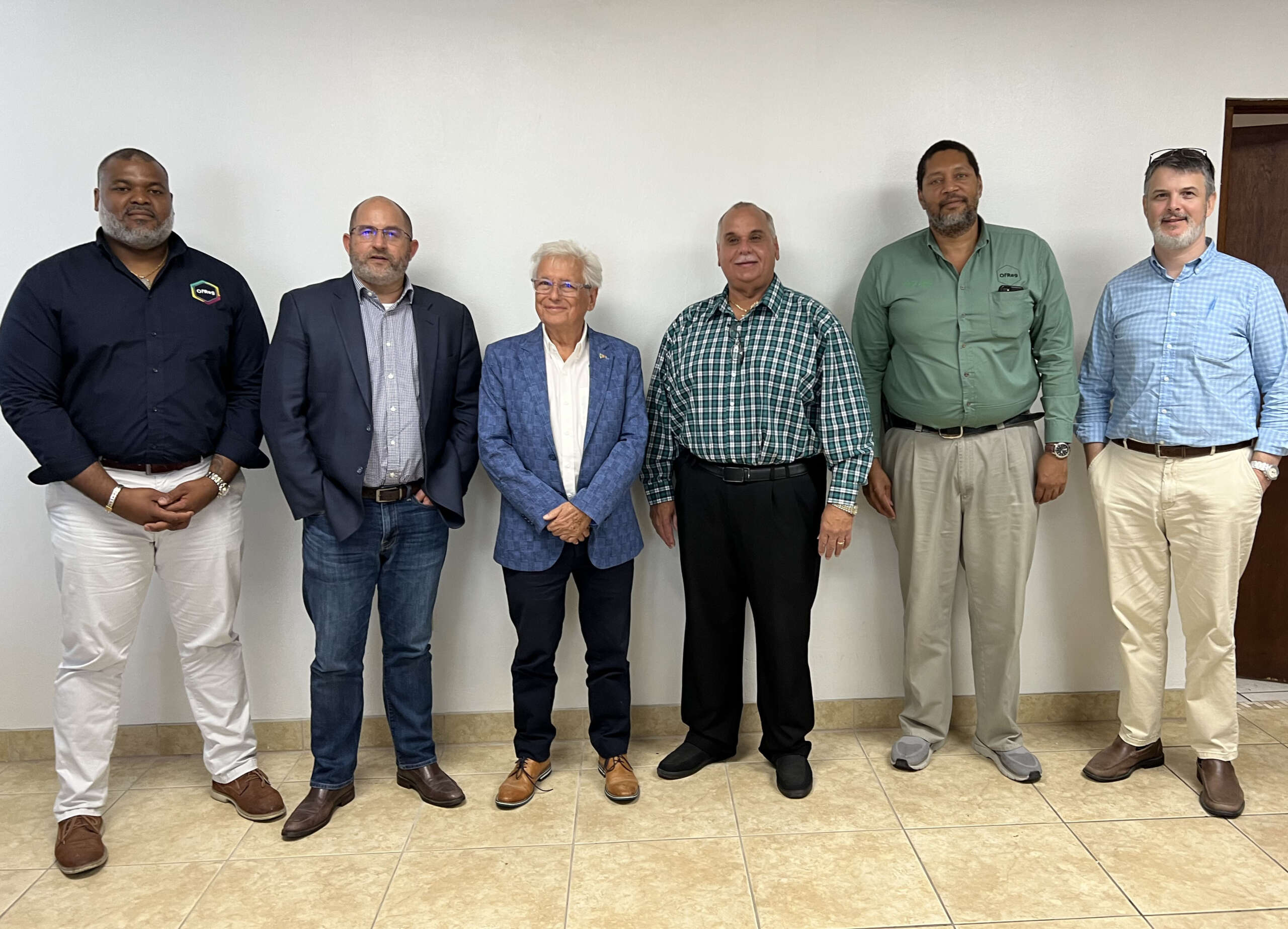 OfReg leadership visits Cayman Brac Cayman Compass