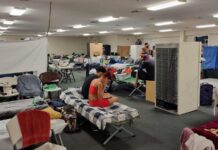 Cuban nationals inexplicably moved from homes to cramped shelter Cubans at Bodden Town Civic Centre