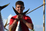 Caymanian junior angler reels in record tuna