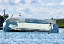 Abandoned boat Cayman Mermaid sinking in Governors Creek