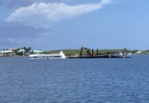 Salvage firm recovering sunken Cayman Mermaid boat