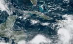 Pressure gradient tightens across Cayman, producing showers