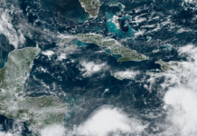 Pressure gradient tightens across Cayman, producing showers