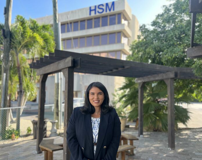 Mrinali Menon outside of HSM’s building on 68 Fort Street, George Town